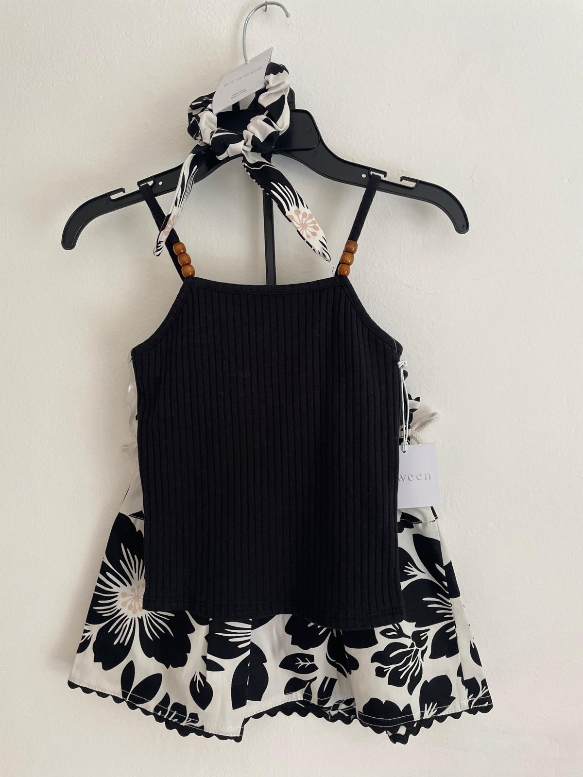 Conjunto Musculosa Pollera y Gomita de pelo talle 6